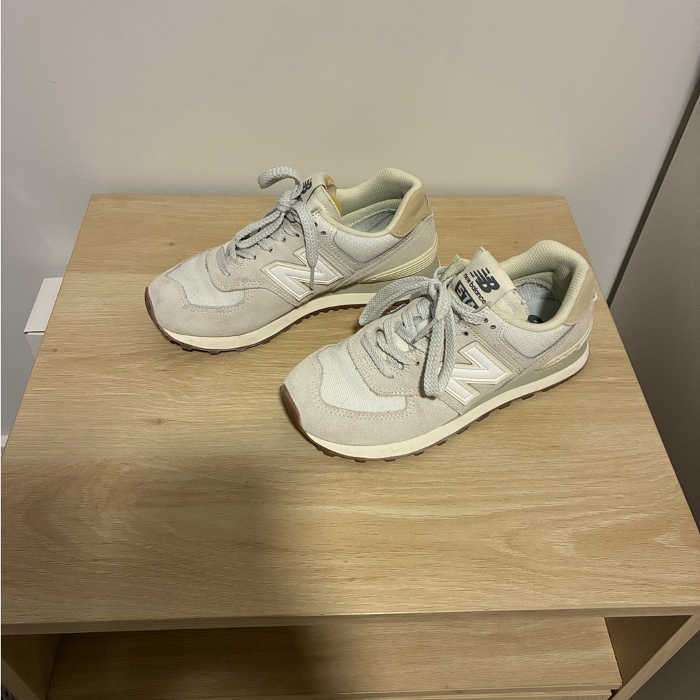 New Balance 574 sneakers in light gray and cream